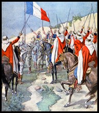 The French flag saluted by French and Arab colonial forces at Ain Salah