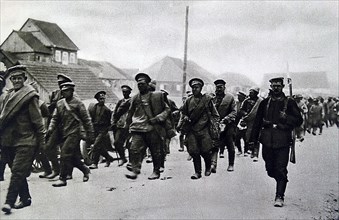 Photograph of Russian prisoners of war walking towards a German prison camp during World War One