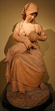 Statue of a peasant woman nursing a baby by Jules Dalou