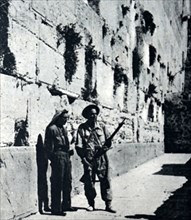 Photograph of both Arab and Jewish soldiers protecting the Wailing Wall
