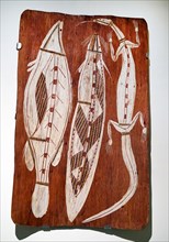 Painted wood depicting a Catfish and Lizard from North Australia