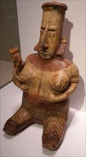 Seated female figure with a baby in her arms, from Mexico