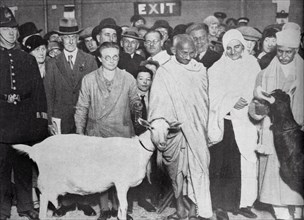 Mahatma Gandhi with his supporter, Madeleine Slade, and two goats