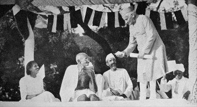 Mahatma Gandhi at a meeting in Allahabad, presided over by Motilal Nehru