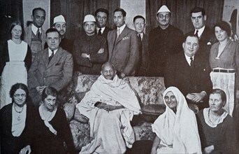 Mahatma Gandhi surrounded by well wishers at a home in London 1931