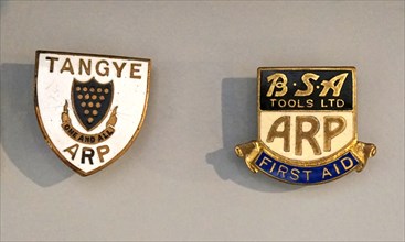 Lapel badges used by the British Civil Defence ARP , in World War Two