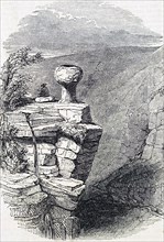 An eroded gritstone boulder at the head of Grindsbrook Clough, Kinder Scout, Derbyshire