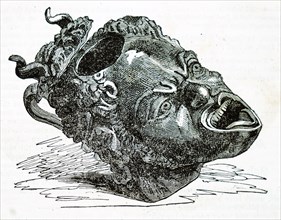 An ancient Roman bronze head of a monster drawn from an archaeological