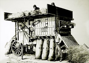 Engraving depicting a threshing and winnowing machine by Barrows and Stewart from Banbury