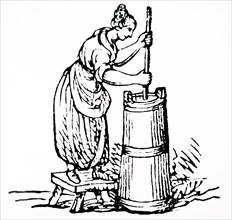 A dairymaid churning butter