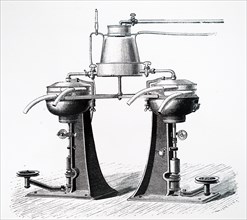 A twin centrifugal cream separators with milk warmer mounted above them