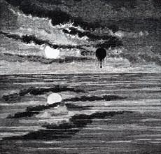 A balloon flying over the sea