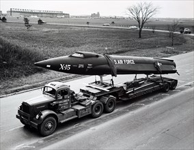 Photograph of the X-15 research aircraft being trucked to Cleveland Public Auditorium for complete assembly and display during the Space Science Fair of 1950