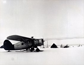 Photograph of a United States Arctic Expeditionary aircraft at research station within the Arctic Circle