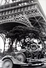 World War Two: German soldiers sit in a vehicle under the Eiffel Tower as they occupy Paris, during the invasion of France 1940