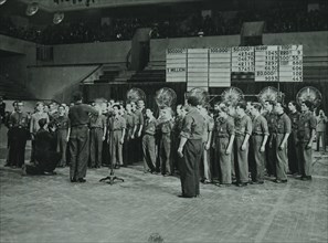 Photograph of a chorus broadcasting a song during the radio announcement of the French National Lottery result 1941, during the German occupation 1941