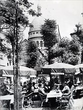 Photograph of German officers relaxing at a café in Montmartre near the Sacre Coeur, in Paris, after the Invasion of France in 1940, in World War Two