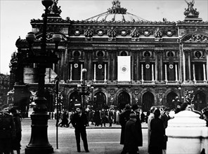Photograph of Nazi flags hanging from the Paris Opera House, during the German occupation of France, in World War Two