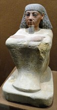 Egyptian Statue of the scribe of the Grain accounts, Maa-no-Amon, Limestone, 1500 BC