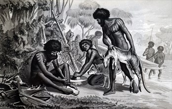 Australian aborigines preparing a meal using a bow drill a prehistoric form of drilling tool, which was used to produce fire