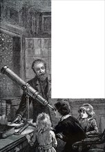 Children looking at the night sky with a portable refractor