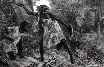 Australian aborigines hunting with a spear launched by a throwing stick and boomerang
