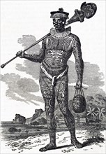 A Marquesas Islander with a heavily tattooed body