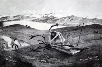 A man butchering a beast using a flint axe