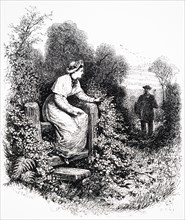 A girl sitting a stile waiting for her lover who is walking towards her down the lane with hedgerows either side