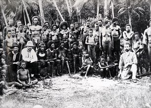 Photograph of New Guinea villagers with European visitors