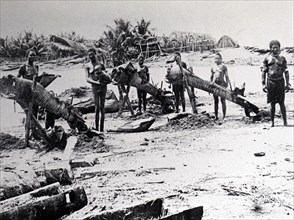Photograph of New Guinea villagers preparing to go fishing