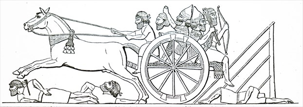Assyrian warriors in a cart captured from the enemy