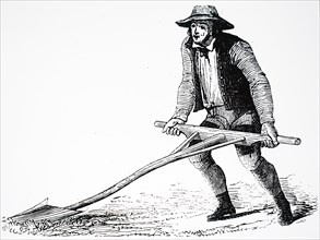 A farmer using a mollebart, or a levelling spade