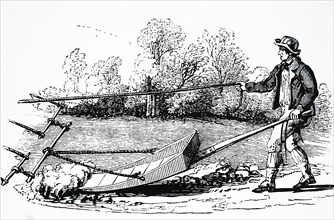 A farmer using a mollebart, or a levelling spade