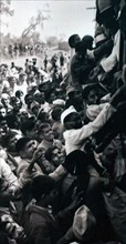 crowds travel to New Delhi, to watch the cremation of Mohandas Karamchand Gandhi 1869 – 1948), in 1948