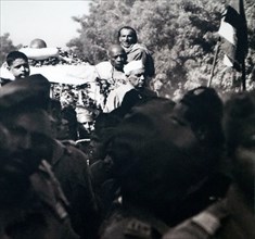 crowds watch the cremation of Mohandas Karamchand Gandhi 1869 – 1948), in 1948