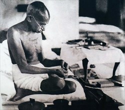 Mahatma Gandhi spinning homespun cloth during a protest against British Rule in India