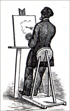 An artist using his easel
