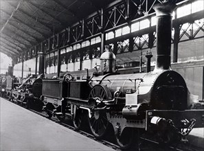 Photograph of a 'Buddicom' locomotive, shown in the Gare St Lazarre, Paris