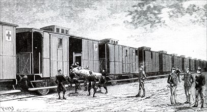 A stretcher case being brought on board a French military hospital train
