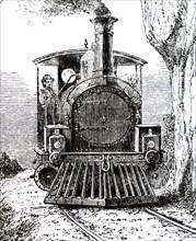 A locomotive driving through the countryside