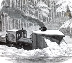 A locomotive snowplough being used to clear a snow drift in Canada