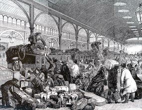The arrival of a Christmas train in a London train station