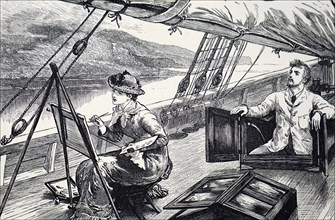 A young woman painting on the deck of a boat as it sails down a river