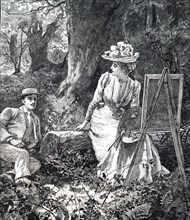 A young artist presenting her work to her lover as the relax in the woods