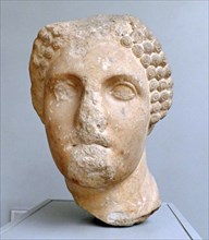 Head from a colossal statue of a woman wearing a sakkos (cap)