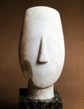 Head of a female, Cycladic statue of the "idol with crossed arms" type