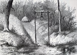 Wood engraving titled 'Entry to The Fetish Hut in Lunda'. Dated 19th Century