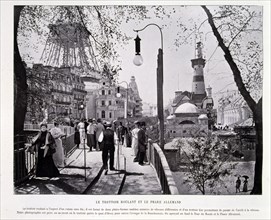 Photograph of a street scene of the rolling pavement and the German lighthouse