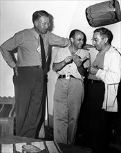 Atomic physicists Ernest O. Lawrence, Enrico Fermi, and Isidor Rabi
